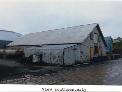 Photo of weathered Blubbering House building from a southwesterly view.